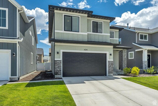 4214 E Sun Crest Dr Unit Lot68, Eagle Mountain, UT 84005 - modern home featuring board and batten siding, stone siding, a garage, and driveway