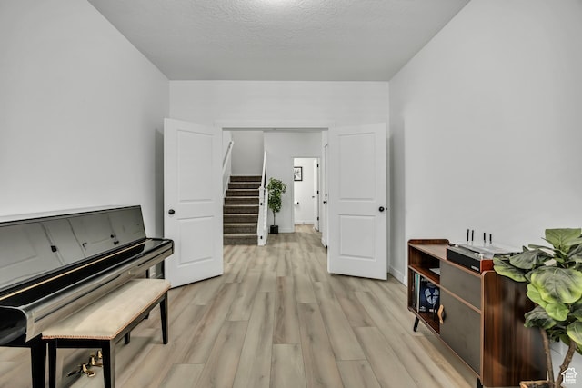 4214 E Sun Crest Dr Unit Lot68, Eagle Mountain, UT 84005 - sitting room featuring stairs and light wood-style flooring