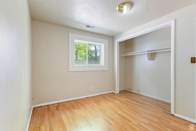 793 E 100 S, Hyrum, UT 84319 - unfurnished bedroom featuring wood finished floors, a closet, and baseboards