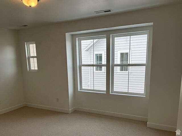 6889 W S Jordan Pkwy, South Jordan, UT 84009 - empty room with baseboards and light colored carpet