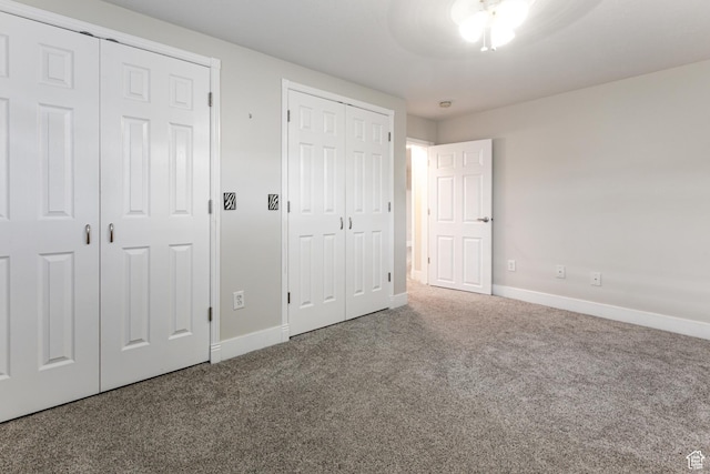 3380 S 930 W, Syracuse, UT 84075 - unfurnished bedroom with multiple closets, carpet floors, and baseboards