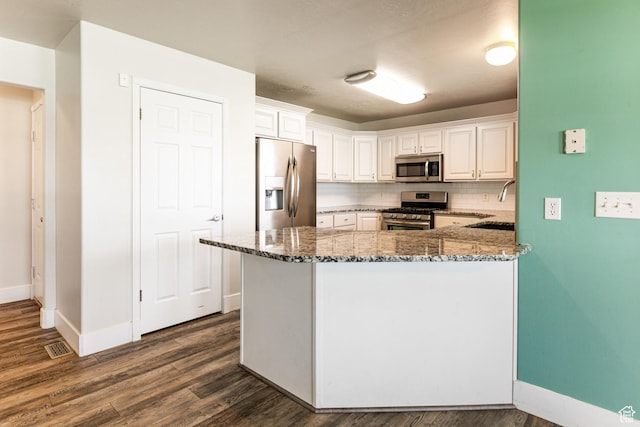 3380 S 930 W, Syracuse, UT 84075 - kitchen featuring stainless steel appliances, stone counters, baseboards, dark wood-style flooring, and a sink