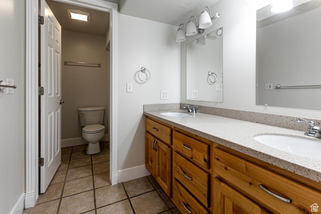 3380 S 930 W, Syracuse, UT 84075 - full bathroom with double vanity, tile patterned flooring, toilet, and baseboards