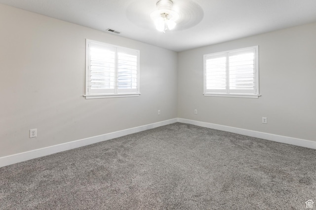 3380 S 930 W, Syracuse, UT 84075 - carpeted empty room featuring plenty of natural light, baseboards, and a ceiling fan