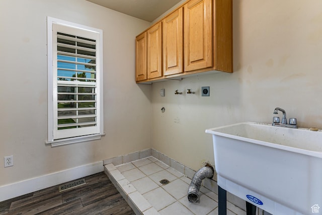 3380 S 930 W, Syracuse, UT 84075 - washroom featuring cabinet space, electric dryer hookup, washer hookup, wood finished floors, and baseboards