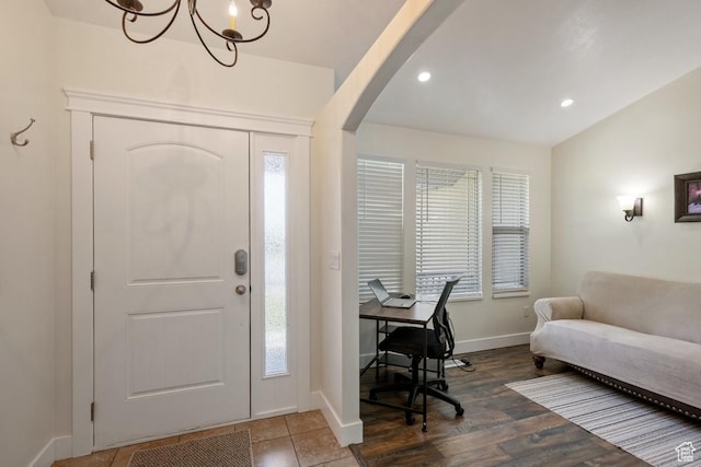 3638 S Blazing Oak Dr, Magna, UT 84044 - foyer entrance with arched walkways, healthy amount of natural light, a chandelier, baseboards, and recessed lighting