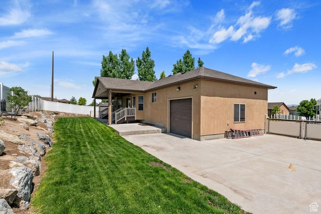 3638 S Blazing Oak Dr, Magna, UT 84044 - view of front of property featuring an attached garage, concrete driveway, and stucco siding