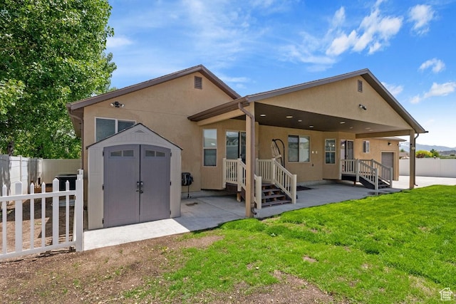 3638 S Blazing Oak Dr, Magna, UT 84044 - back of house with a patio and stucco siding