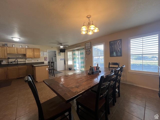 865 E 980 N, Tooele, UT 84074 - tiled dining space featuring a chandelier, ceiling fan, a sink, and baseboards