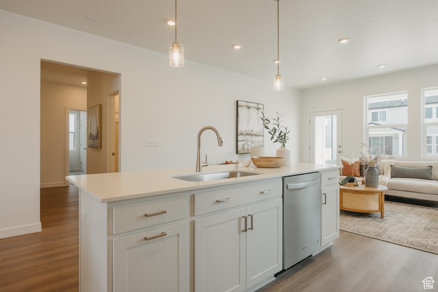 4625 N Fallow Way Unit 513, Eagle Mountain, UT 84005 - kitchen with dishwasher, a sink, wood finished floors, a center island with sink, and decorative light fixtures