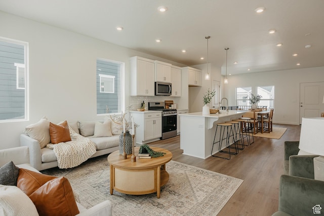 4625 N Fallow Way Unit 513, Eagle Mountain, UT 84005 - living area with light wood finished floors and recessed lighting