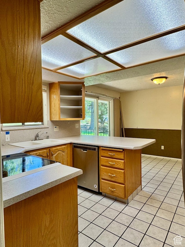 246 N 2800 E, Layton, UT 84040 - kitchen with dishwasher, a peninsula, a textured ceiling, light tile patterned flooring, and light countertops
