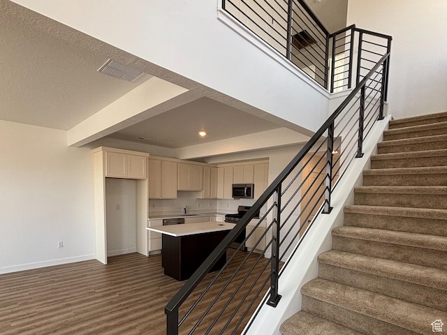 6907 W S Jordan Pkwy, South Jordan, UT 84009 - staircase featuring baseboards, wood finished floors, and recessed lighting