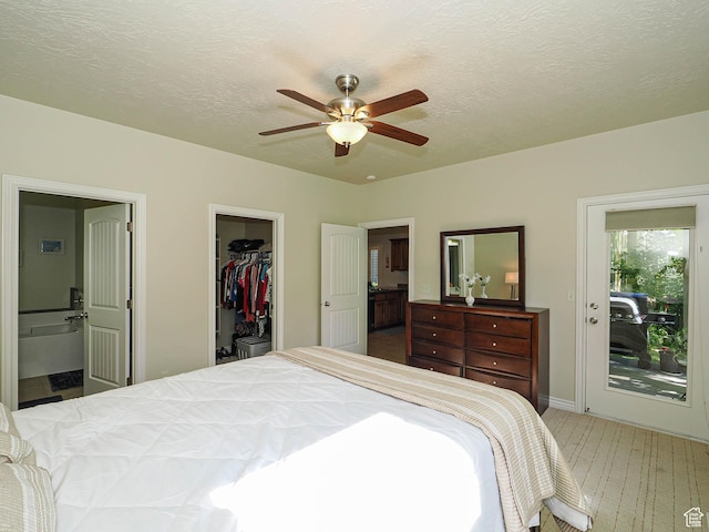 7183 S 420 E, Midvale, UT 84047 - carpeted bedroom with a spacious closet, a closet, a textured ceiling, connected bathroom, and a ceiling fan