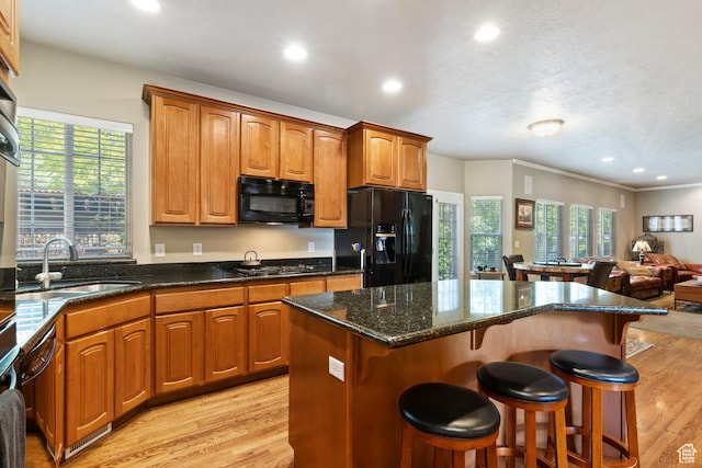 6512 S Timpanogos Way W, Taylorsville, UT 84129 - kitchen featuring black appliances, a sink, open floor plan, light wood-style floors, and recessed lighting