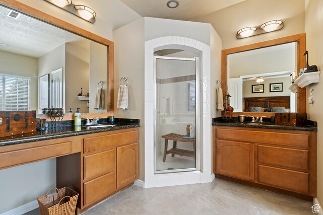 6512 S Timpanogos Way W, Taylorsville, UT 84129 - bathroom featuring a shower stall, vanity, and marble finish floors