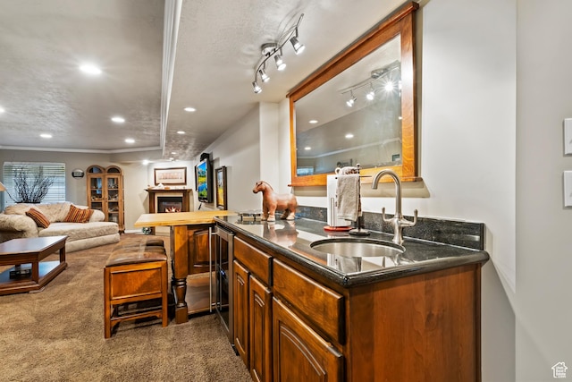 6512 S Timpanogos Way W, Taylorsville, UT 84129 - indoor wet bar featuring recessed lighting, dark colored carpet, a warm lit fireplace, and beverage cooler