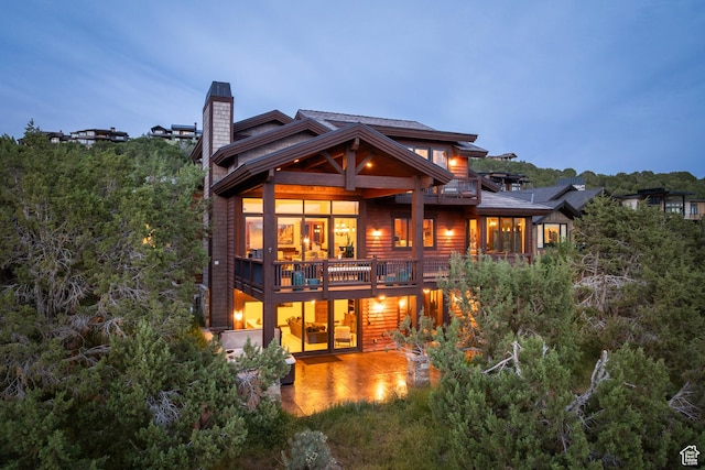 2314 E Flattop Mountain Dr Unit 89, Heber City, UT 84032 - rear view of property with a chimney and a balcony