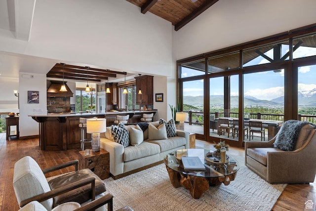 2314 E Flattop Mountain Dr Unit 89, Heber City, UT 84032 - living area featuring hardwood / wood-style flooring, a mountain view, high vaulted ceiling, and wood ceiling with exposed beams