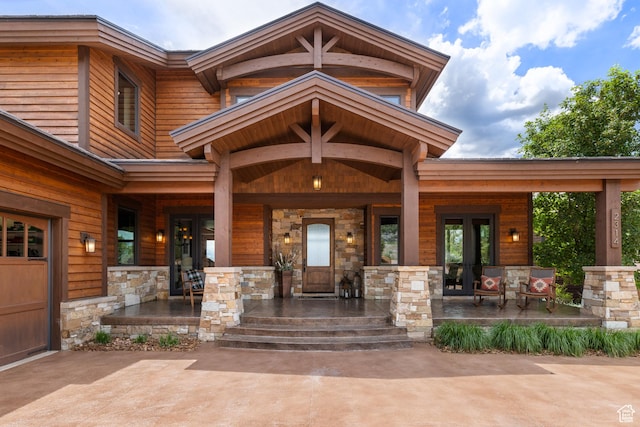 2314 E Flattop Mountain Dr Unit 89, Heber City, UT 84032 - property entrance with a porch, stone siding, and french doors