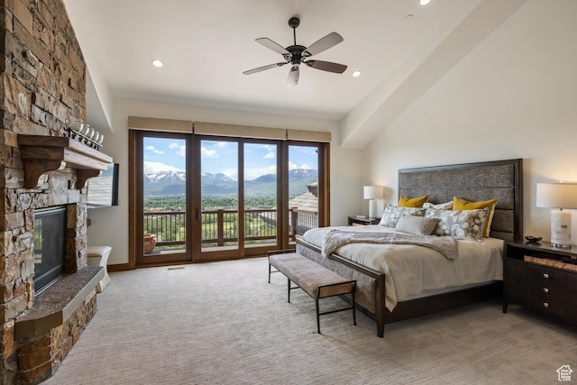 2314 E Flattop Mountain Dr Unit 89, Heber City, UT 84032 - carpeted bedroom with access to exterior, a mountain view, a stone fireplace, recessed lighting, and a ceiling fan