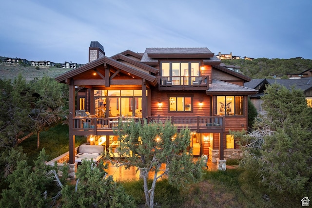 2314 E Flattop Mountain Dr Unit 89, Heber City, UT 84032 - back of house with a balcony and a chimney