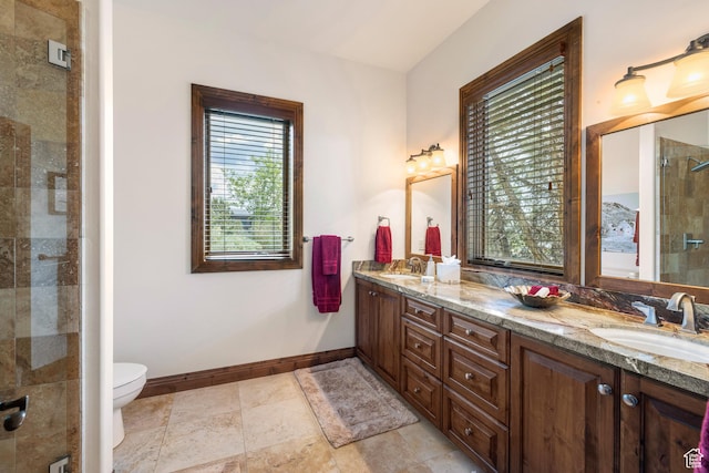 2314 E Flattop Mountain Dr Unit 89, Heber City, UT 84032 - bathroom with double vanity, baseboards, a stall shower, and toilet