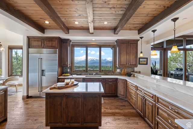 2314 E Flattop Mountain Dr Unit 89, Heber City, UT 84032 - kitchen featuring built in fridge, a sink, wooden ceiling with exposed beams, light countertops, and backsplash