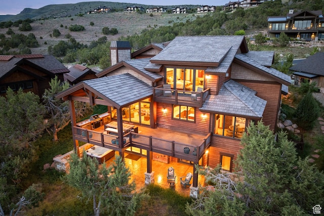 2314 E Flattop Mountain Dr Unit 89, Heber City, UT 84032 - rear view of house with a balcony, a chimney, and a mountain view