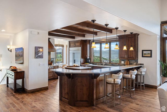 2314 E Flattop Mountain Dr Unit 89, Heber City, UT 84032 - kitchen with stainless steel built in refrigerator, healthy amount of natural light, a kitchen bar, beamed ceiling, and recessed lighting