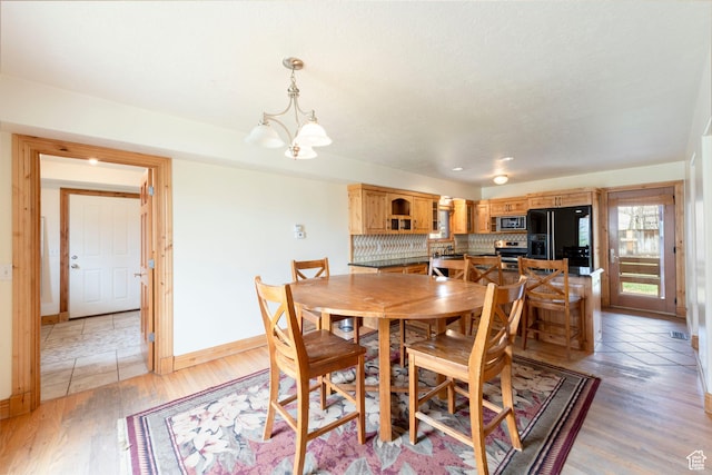 2003 Venus Ct, Park City, UT 84060 - dining space featuring baseboards, a chandelier, and light wood-type flooring