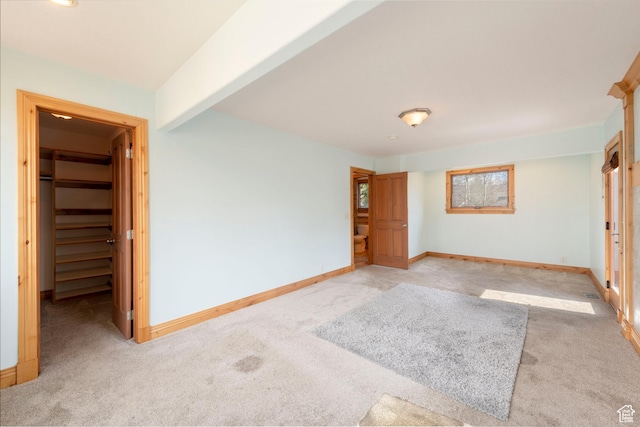 2003 Venus Ct, Park City, UT 84060 - unfurnished bedroom with light colored carpet, a spacious closet, baseboards, and a closet