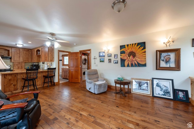 2003 Venus Ct, Park City, UT 84060 - living area with estacked washer and dryer, hardwood / wood-style flooring, a ceiling fan, and baseboards