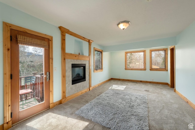 2003 Venus Ct, Park City, UT 84060 - unfurnished living room with carpet, a tiled fireplace, and baseboards
