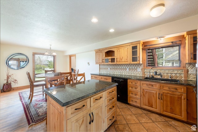 2003 Venus Ct, Park City, UT 84060 - kitchen featuring black dishwasher, backsplash, open shelves, a kitchen island, and a sink