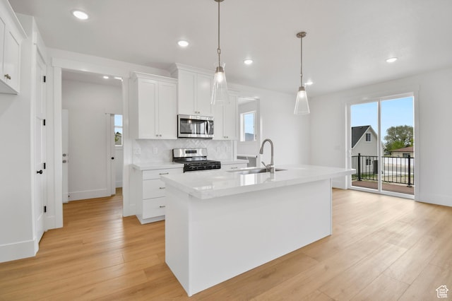 1309 E 370 S, Payson, UT 84651 - kitchen featuring stainless steel appliances, a sink, healthy amount of natural light, light wood-style flooring, and recessed lighting