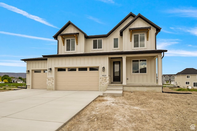 1309 E 370 S, Payson, UT 84651 - view of front of property featuring covered porch, concrete driveway, board and batten siding, and an attached garage