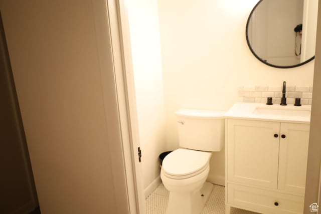 1834 E Cloverdale Rd S, Cottonwood Heights, UT 84121 - bathroom with vanity, toilet, backsplash, and tile patterned floors