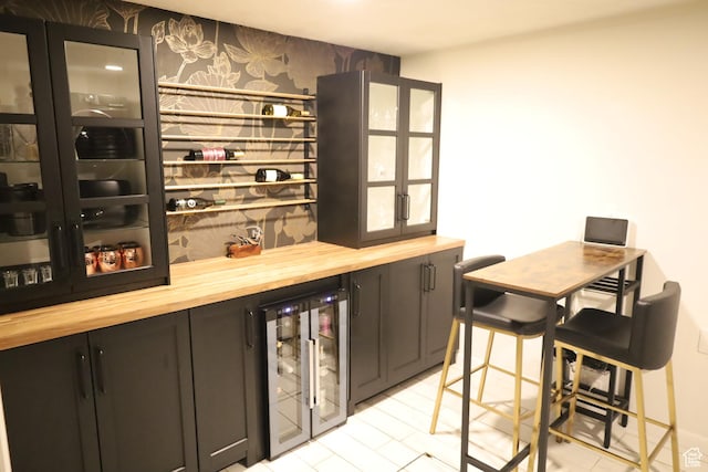 1834 E Cloverdale Rd S, Cottonwood Heights, UT 84121 - indoor dry bar with wallpapered walls, beverage cooler, and an accent wall