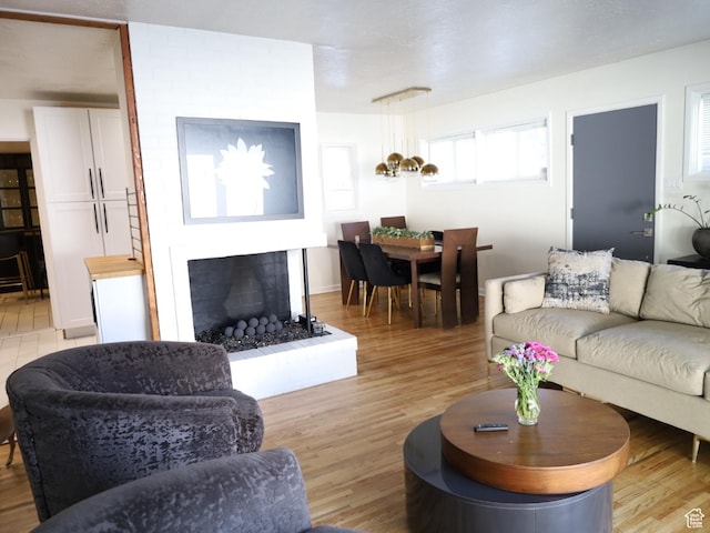 1834 E Cloverdale Rd S, Cottonwood Heights, UT 84121 - living room with a fireplace with raised hearth and light wood-type flooring