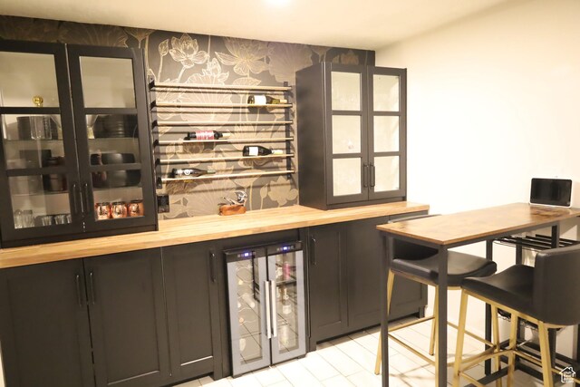 1834 E Cloverdale Rd S, Cottonwood Heights, UT 84121 - indoor dry bar with wine cooler and wallpapered walls