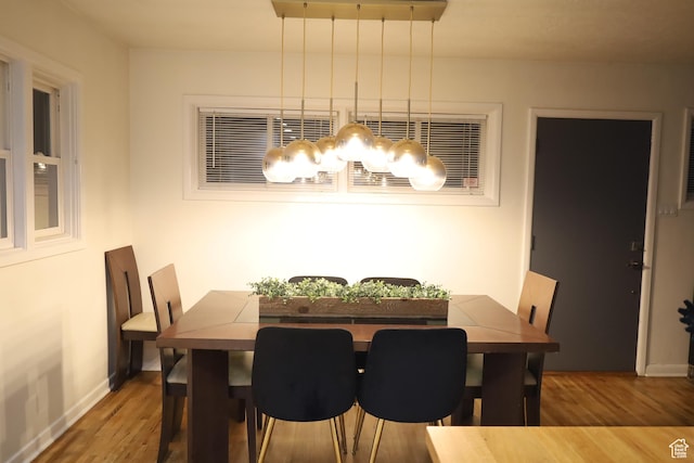 1834 E Cloverdale Rd S, Cottonwood Heights, UT 84121 - dining space with wood finished floors, baseboards, and a chandelier