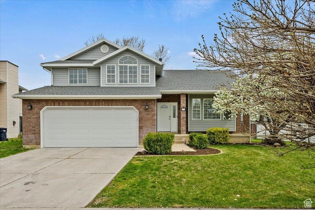1134 N 2825 W, Layton, UT 84041 - view of front of home with a front yard, an attached garage, roof with shingles, and brick siding