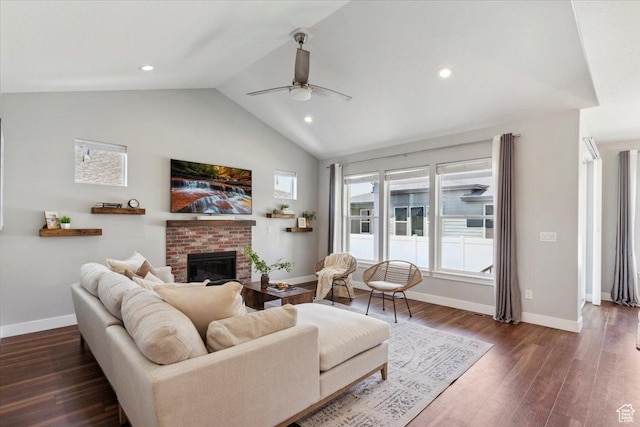 3222 W Harvard Dr, Mountain Green, UT 84050 - living room with lofted ceiling, ceiling fan, baseboards, a brick fireplace, and dark wood-style floors