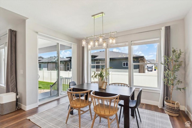 3222 W Harvard Dr, Mountain Green, UT 84050 - dining space with baseboards and dark wood finished floors