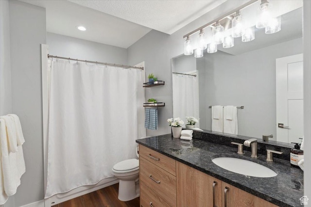 3222 W Harvard Dr, Mountain Green, UT 84050 - full bathroom featuring toilet, vanity, and wood finished floors