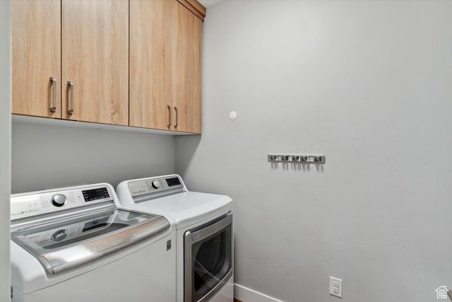 3222 W Harvard Dr, Mountain Green, UT 84050 - laundry room featuring washing machine and dryer, cabinet space, and baseboards