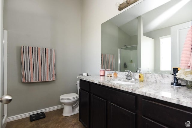 312 W 970 N, Tooele, UT 84074 - full bathroom with a shower with door, toilet, vanity, and baseboards