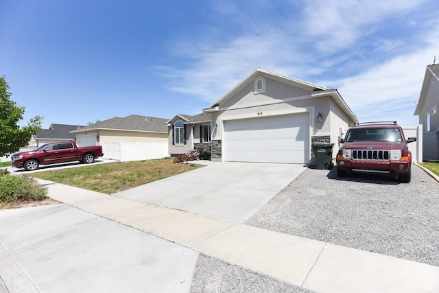 312 W 970 N, Tooele, UT 84074 - ranch-style home with stucco siding, an attached garage, and driveway