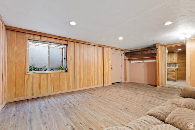 1095 N 100 W, Pleasant Grove, UT 84062 - unfurnished living room featuring wood finished floors, wooden walls, recessed lighting, and baseboards